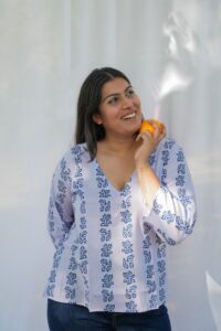 Three quarter sleeve blue floral printed cotton kurti featuring elegant floral patterns and breathable fabric for everyday comfort.